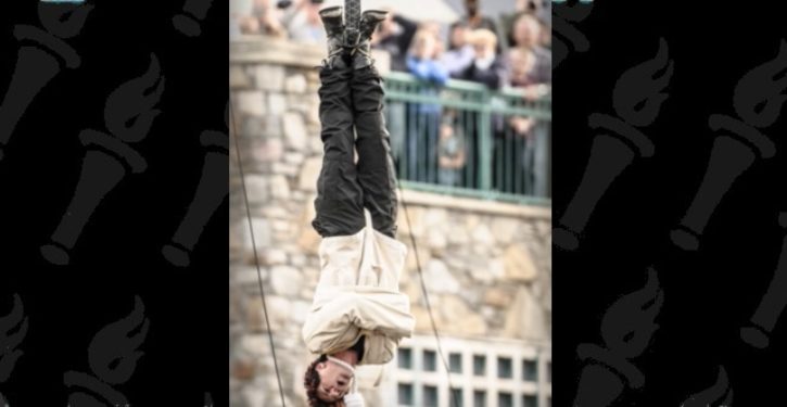 Illusionist Criss Angel rushed to hospital after upside-down strait jacket trick goes horribly wrong