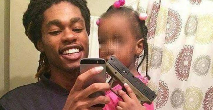 Police investigate social media photo of toddler holding handgun