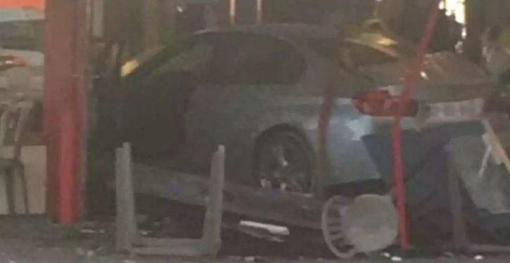 Car ‘deliberately’ driven into pizzeria outside Paris, killing child