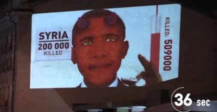 Video in Moscow shows Obama as devil devouring foreign peoples