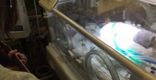 Heart-wrenching story of father singing to dying newborn son after wife dies in childbirth (Video) by Howard Portnoy