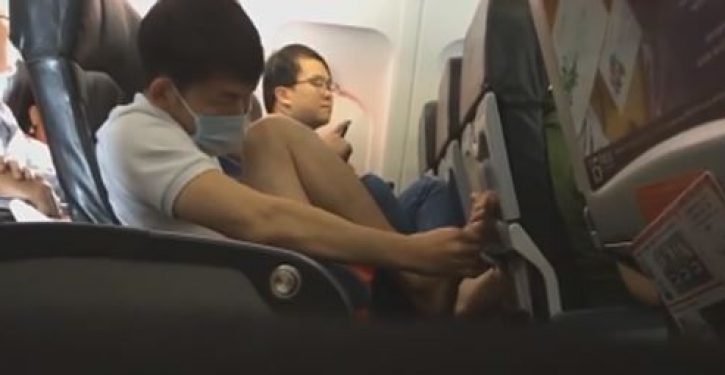 Plane passenger caught picking skin on foot, flicking same onto floor
