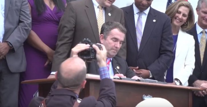 Report: Northam tells staff it can’t be him in yearbook photo because his left hand is dominant
