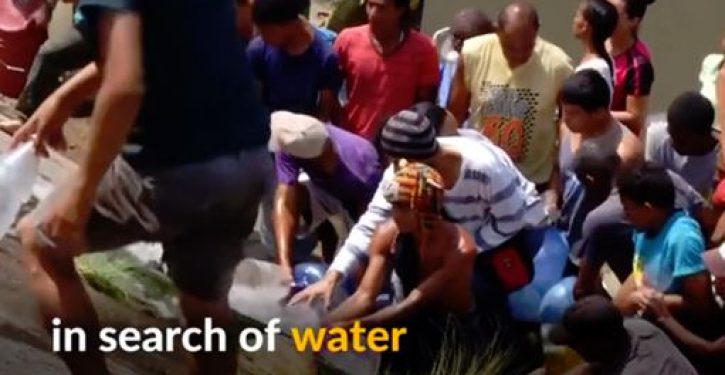 Desperate Venezuelans swarm sewage drains in search of water