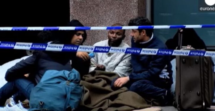 Belgian woman now regrets inviting migrants to camp in her garden; demands they leave