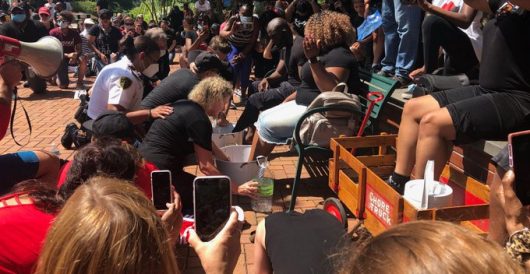 It’s come to this: ‘Guilty’ whites, including cops, kneel, wash feet of black community leaders by LU Staff