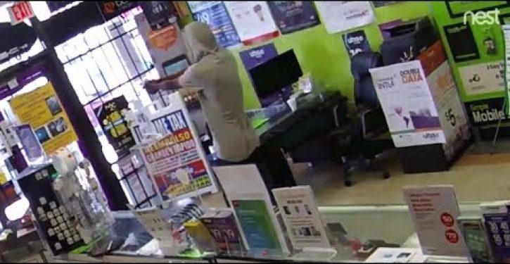 Watch what happens when would-be thief is locked in store he is attempting to rob