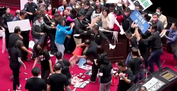 Fists and pig guts fly in Taiwan parliament debate on U.S. pork