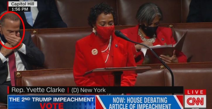 Science, science, science: Democratic lawmaker lowers mask to sneeze into hand