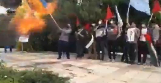 Iranian demonstrator accidentally sets himself on fire while burning Israeli flag by Ben Bowles