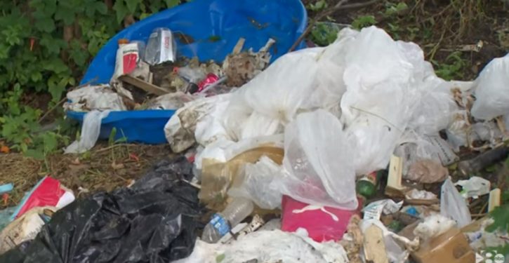 Dallas property owner ticketed for homeless trash left on adjacent city land