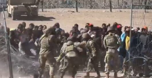 Video Shows Illegal Migrants Overwhelming Texas National Guard, Storming Border Wall by Daily Caller News Foundation