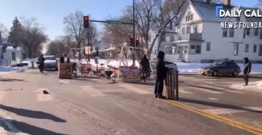 Police Tear Down Anti-ICE Road Blockade After Masked Men Assault Reporter by Daily Caller News Foundation