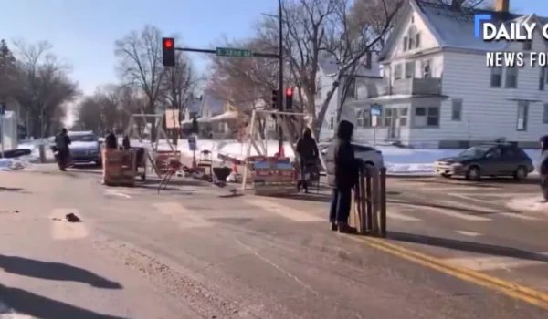 Police Tear Down Anti-ICE Road Blockade After Masked Men Assault Reporter by Daily Caller News Foundation